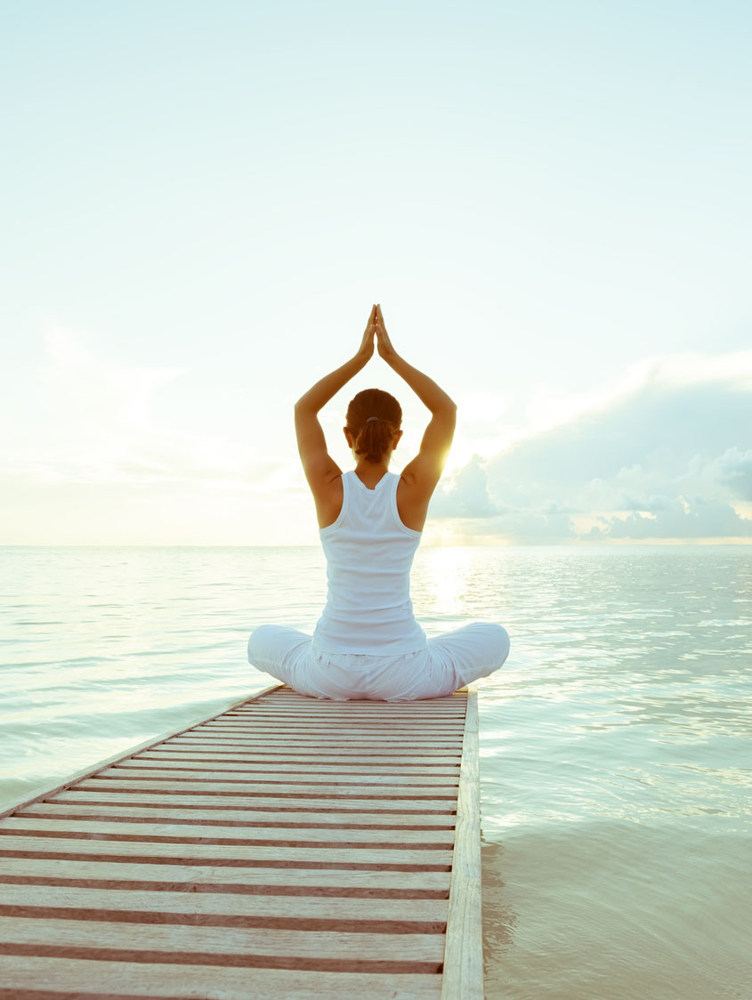 Practicing yoga at seashore